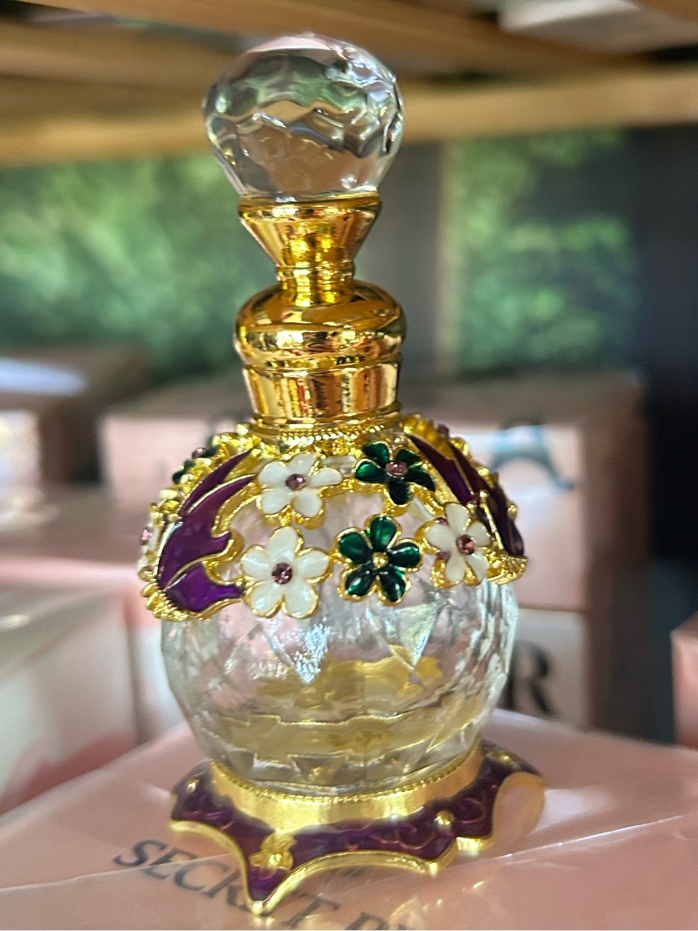 Ornate glass perfume dispenser.